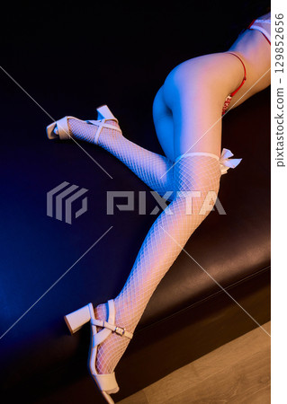Elegant Seduction A Captivating and Charming Pose in Stylish and Alluring Lingerie 129852656