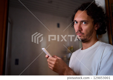 A Colorful Remote Control Set Against the Backdrop of a Dimly Lit Room Environment A Colorful Remote Control Set Against the Backdrop of a Dimly Lit Room Environment 129853001