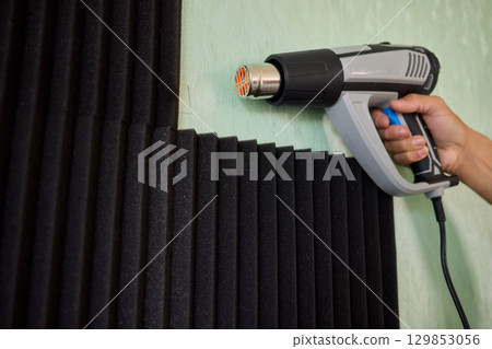 Applying Soundproof Foam Panels Securely Using a Hot Glue Gun for Better Performance and Insulation 129853056