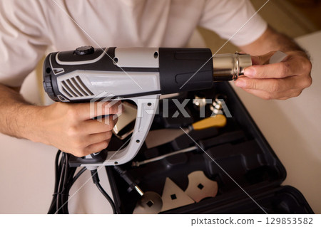 This versatile heat gun is ideal for various DIY projects, home repairs, and renovations This versatile heat gun is ideal for various DIY projects, home repairs, and renovations 129853582