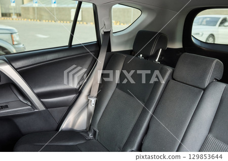 Car back seat with headrest and arm rest, a comfortable automotive fixture 129853644