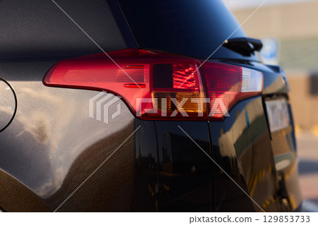 Closeup of a cars automotive tail brake light Closeup of a cars automotive tail brake light 129853733