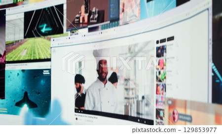 Interconnected screens collage showing modern social media feed clips. Visualization of data driven world with video distribution service content highlighting modern digital lifestyle 129853977