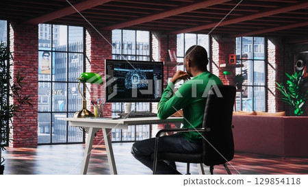 African american technician writes code on AI brain neural network for machine learning, doing maintenance and debugging the software systems. IT expert uses programming language. Camera A. 129854118