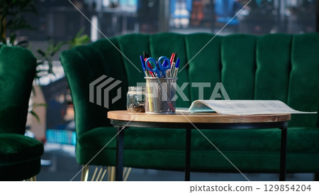 Business lobby featuring sofa in a bright modern boardroom with glass elements and high end furniture, organized for office life and structured to support meetings and corporate culture. Business lobby featuring sofa in a bright modern boardroom with glass elements and high end furniture, organized for office life and structured to support meetings and corporate culture. 129854204