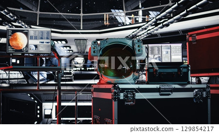 Malfunction indicator blinking in starship over astronaut helmet next to laptop showing performance metrics during cosmic flight. Danger alert flashing over cosmonaut gear in spaceship 129854217