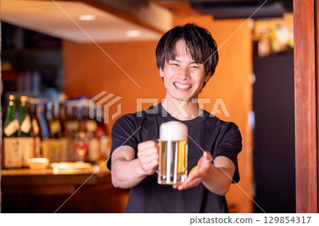 Izakaya - A man working at an izakaya Izakaya - A man working at an izakaya 129854317