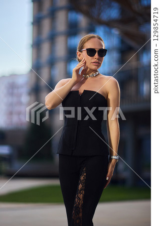 An Elegant Fashion Portrait Featuring a Beautiful Woman in a Stylish and Trendy Outfit An Elegant Fashion Portrait Featuring a Beautiful Woman in a Stylish and Trendy Outfit 129854719
