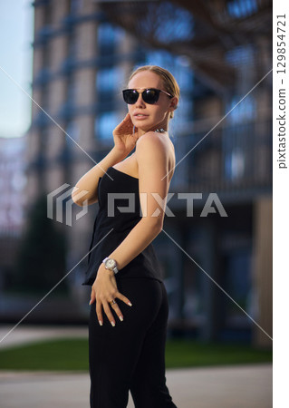 An Elegant Fashion Portrait Featuring a Beautiful Woman in a Stylish and Trendy Outfit An Elegant Fashion Portrait Featuring a Beautiful Woman in a Stylish and Trendy Outfit 129854721