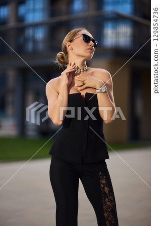 An Elegant Fashion Portrait Featuring a Beautiful Woman in a Stylish and Trendy Outfit An Elegant Fashion Portrait Featuring a Beautiful Woman in a Stylish and Trendy Outfit 129854736