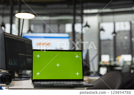 Empty office environment showcases tech tools of green screen and resources essential for business planning, performance analysis and the development of insights for innovation. Empty office environment showcases tech tools of green screen and resources essential for business planning, performance analysis and the development of insights for innovation. 129854788