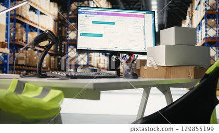 Empty warehouse setting used for shipping cargo products in boxes from online shopping local brand, ensuring fast delivery from the supply room. Fulfillment center operations. 129855199