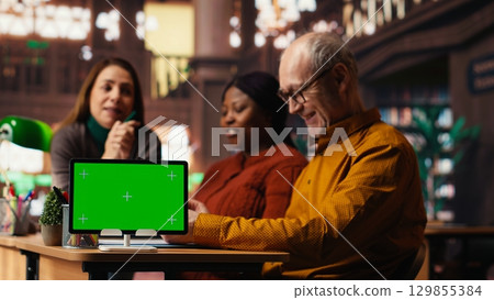 Diverse performers team preparing for theatre play with green screen, practicing script and dialogue lines with discipline and passion. Developing their characters with love for acting. 129855384