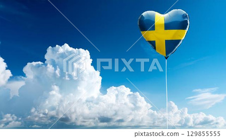 Swedish flag heart shaped balloon and blue sky 129855555