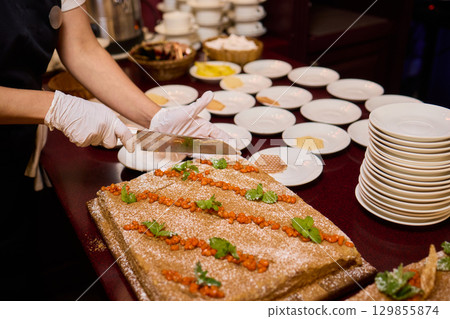 An Elegant Feast Featuring a Beautiful and Traditional Cake Presentation for All 129855874