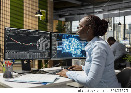Trader in office using neural network AI models to enhance predictive accuracy of stock market movements. Prop firm employee leveraging artificial intelligence to optimize trading strategies 129855875