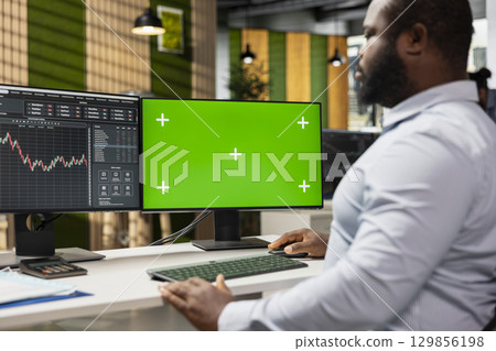 Risk analyst using green screen PC to evaluate trading strategies, minimizing losses and improve returns. Expert using data reports on chroma key computer to assess financial markets volatility Risk analyst using green screen PC to evaluate trading strategies, minimizing losses and improve returns. Expert using data reports on chroma key computer to assess financial markets volatility 129856198