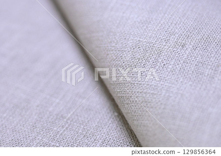 beige hemp viscose natural fabric cloth color; sackcloth rough texture of textile fashion beige hemp viscose natural fabric cloth color; sackcloth rough texture of textile fashion 129856364