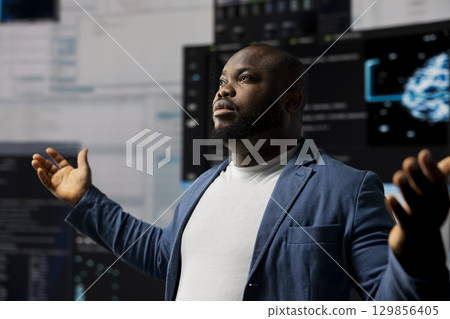 African American developer working in a cyber environment with AI programming language and data science. Technician symbolizes code development, automation for innovation. Tech world. African American developer working in a cyber environment with AI programming language and data science. Technician symbolizes code development, automation for innovation. Tech world. 129856405
