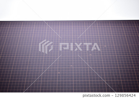 black cutting mat board on white background with line and scale measure guide pattern for art design black cutting mat board on white background with line and scale measure guide pattern for art design 129856424