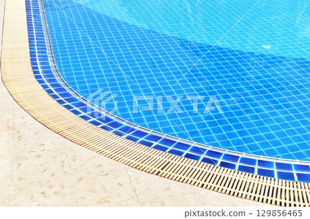 surface of blue swimming pool with water drain surface of blue swimming pool with water drain 129856465