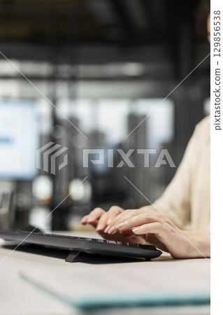 Close up of woman analyst focusing on development strategy and planning organization for global expansion, using digital tools to forecast data insights and achieve corporate growth. Close up of woman analyst focusing on development strategy and planning organization for global expansion, using digital tools to forecast data insights and achieve corporate growth. 129856538