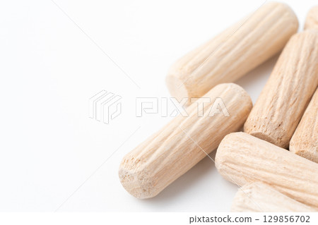 Wooden dowels close-up Wooden dowels close-up 129856702