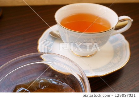 Tea in a cup with a saucer Tea in a cup with a saucer 129857021