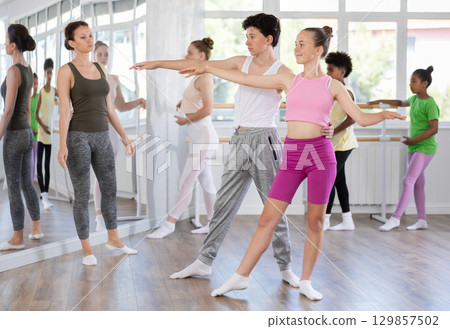 Teenage boy and girl rehearsing paired ballet 129857502