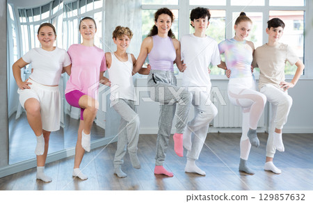 Boys and girls teenagers choreography students perform Irish dance with female teacher Boys and girls teenagers choreography students perform Irish dance with female teacher 129857632