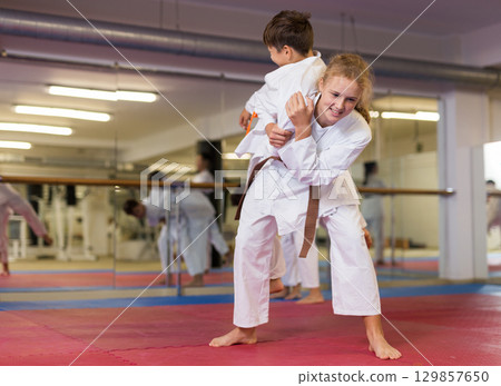 Teenager children practicing new self defense moves 129857650