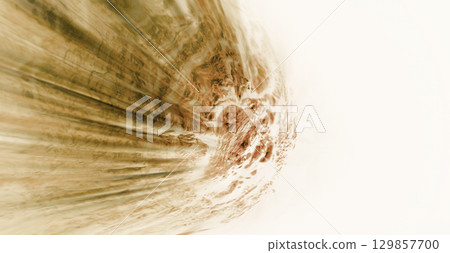 A sci-fi composite image of a rough-textured comet falling at the speed of light against a dazzling white background. A sci-fi composite image of a rough-textured comet falling at the speed of light against a dazzling white background. 129857700