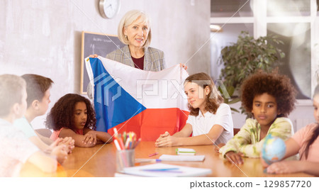 Mature teacher tells pupils the history of the Czech Republic Mature teacher tells pupils the history of the Czech Republic 129857720
