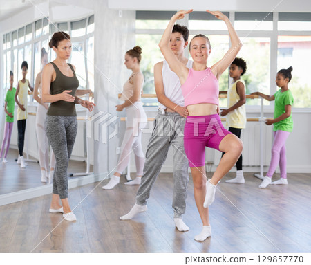Teenage boy and girl rehearsing paired ballet 129857770