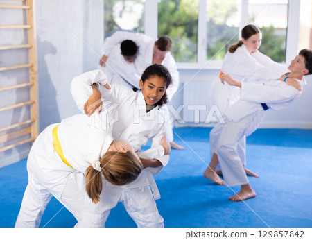 Two girls training judo techniques in studio 129857842