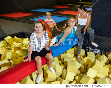 Group of happy children in the amusement park have rest Group of happy children in the amusement park have rest 129857956