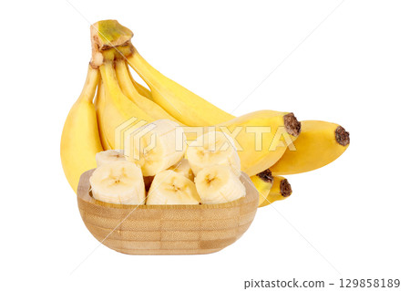 Bunch of ripe bananas with slices in wooden bowl isolated on white background Bunch of ripe bananas with slices in wooden bowl isolated on white background 129858189