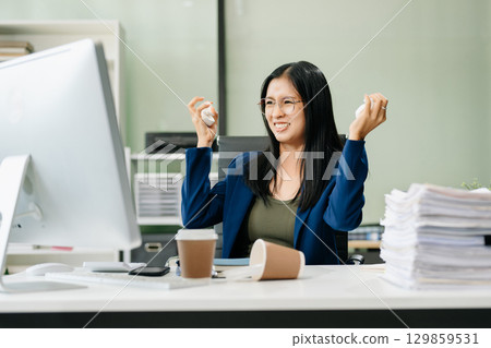 Asian businesswoman is stressed, bored, and overthinking from working 129859531