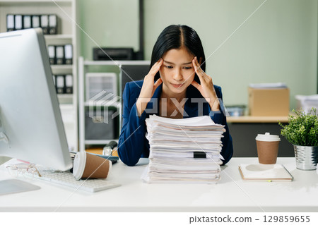 Asian businesswoman is stressed, bored, and overthinking from working 129859655