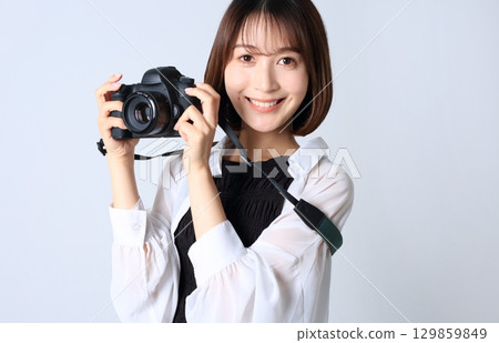 SLR camera and woman image 129859849