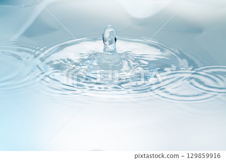 Drops of water falling on the surface of the water. Drops of water falling on the surface of the water. 129859916