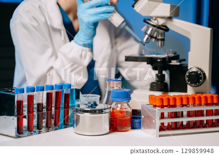 Scientists, beakers, and microscopes in cutting-edge research. Perfect for science and technology projects. Scientists, beakers, and microscopes in cutting-edge research. Perfect for science and technology projects. 129859948