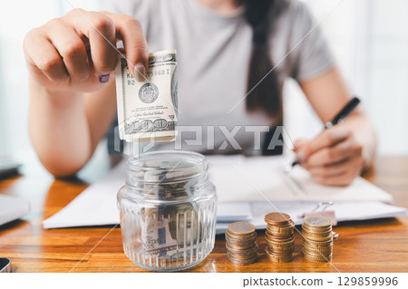 Business, finance and employment, entrepreneur and money concept. Successful young asian office manager, businesswoman showing earned cash, satisfied holding dollars, money dollar bills 129859996