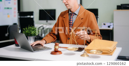 Professional male lawyers consulting on legal cases in a modern office. Perfect for law, business, justice, legal advice Professional male lawyers consulting on legal cases in a modern office. Perfect for law, business, justice, legal advice 129860162