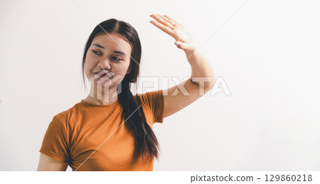 Asian girl expresses dislike, person express negative feeling, concept business complaint from customer ensuring employee satisfaction negative feedback to prevent mental strain customer dislike Asian girl expresses dislike, person express negative feeling, concept business complaint from customer ensuring employee satisfaction negative feedback to prevent mental strain customer dislike 129860218