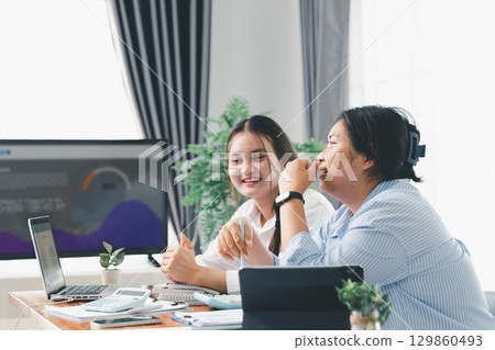 People meeting using laptop computer, calculator, stock market chart paper for analysis plans to improve quality. Team working on project. Analysis business brainstorming corporate smart Concept. 129860493