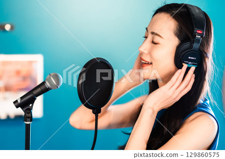 Young woman doing voice training 129860575
