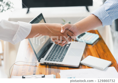 People meeting using laptop computer, calculator, stock market chart paper for analysis plans to improve quality. Team working on project. Analysis business brainstorming corporate smart Concept. People meeting using laptop computer, calculator, stock market chart paper for analysis plans to improve quality. Team working on project. Analysis business brainstorming corporate smart Concept. 129860732