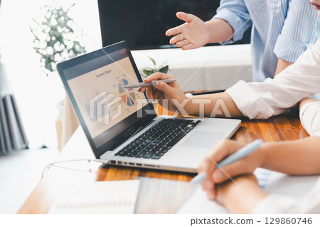 Financial business team in office, financial expert analyze business report graph and finance chart at corporate office. Concept of finance economy, banking business and stock market research. 129860746