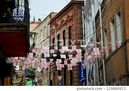 Street decorated with Georgian flags in Old Town in Tbilisi, Georgia Street decorated with Georgian flags in Old Town in Tbilisi, Georgia 129860811
